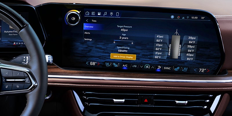 Vehicle dashboard touchscreen displaying tire pressure monitoring system