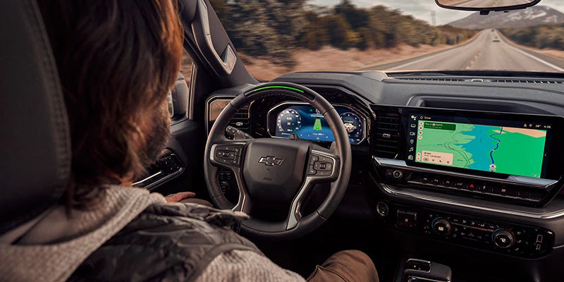 Driver's view inside a Chevrolet Silverado 1500, displaying the steering wheel