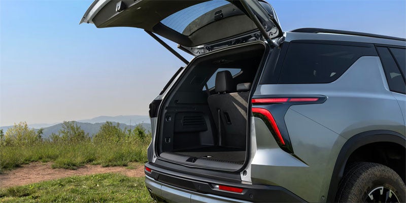 2027 Chevrolet Traverse with the power liftgate open, showing the rear cargo area