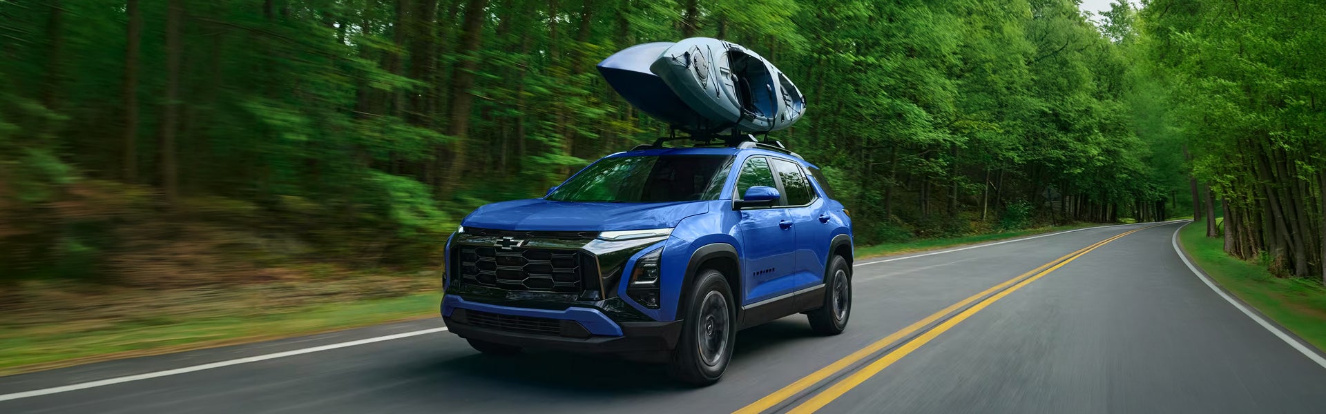 2027 Chevrolet Equinox EV shown from the rear with the liftgate raised and the cargo floor clear