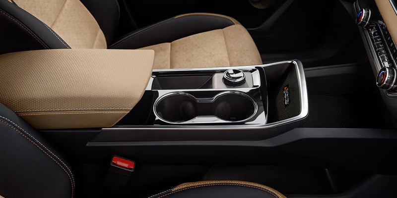 2027 Chevrolet Equinox EV driver using the center touchscreen from the front seat