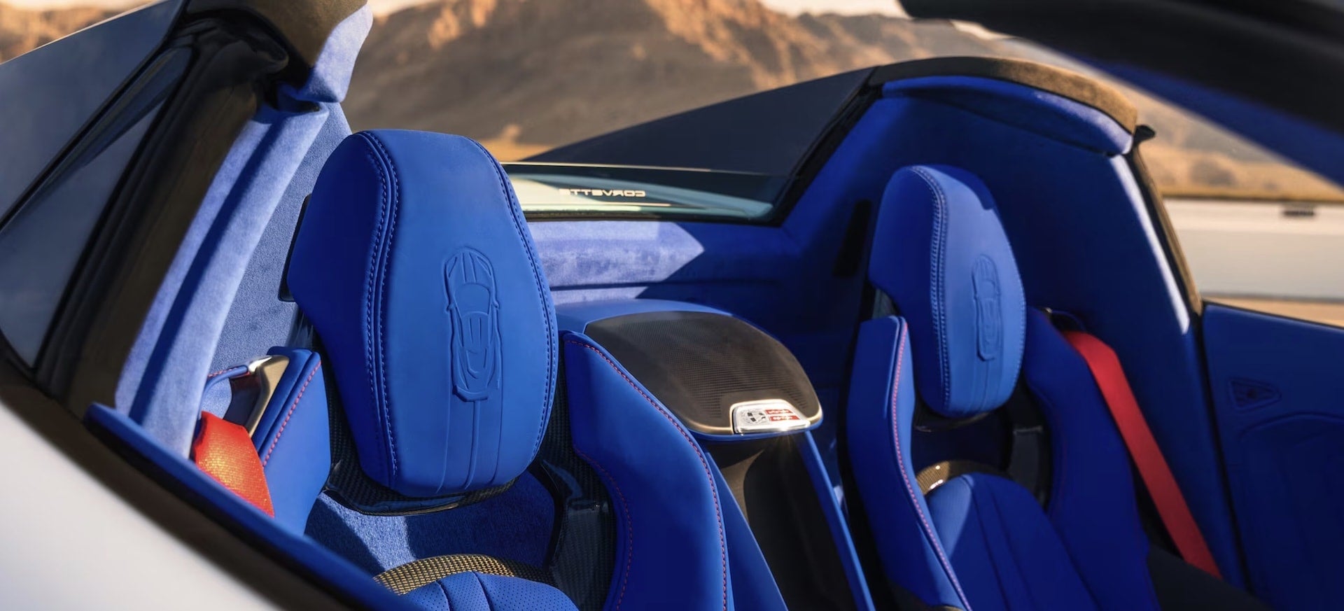 2027 Chevrolet Corvette Grand Sport blue suede seats with embossed Corvette silhouette headrests