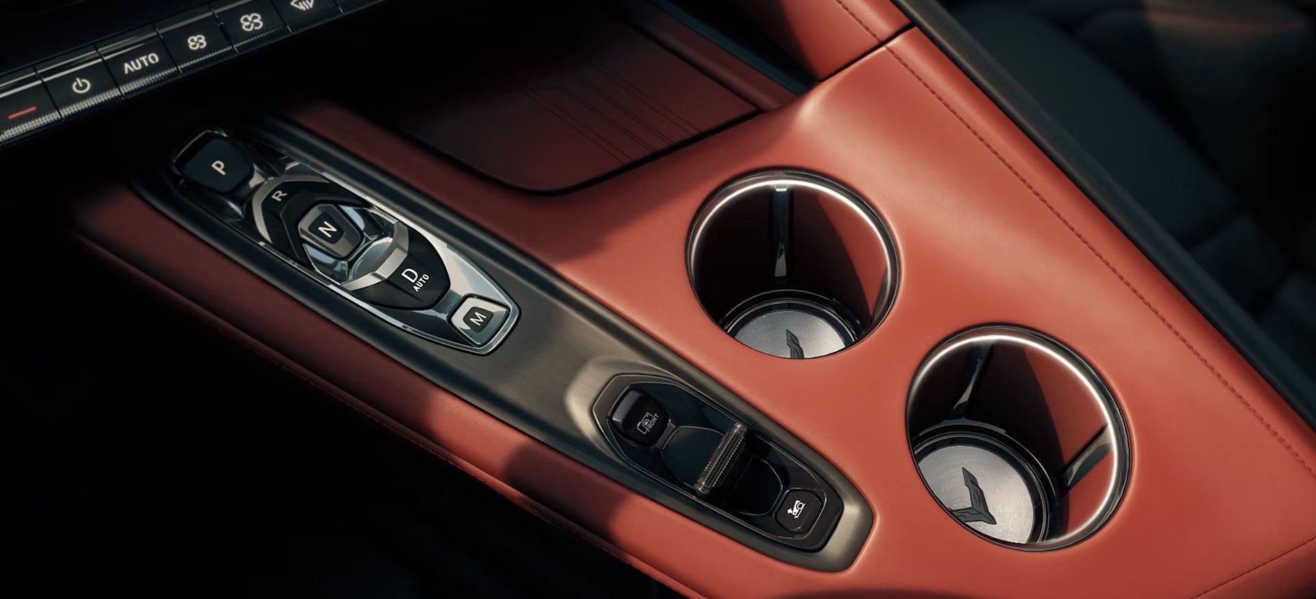 2027 Chevrolet Corvette Grand Sport centre console with gear selector and cupholders in red leather