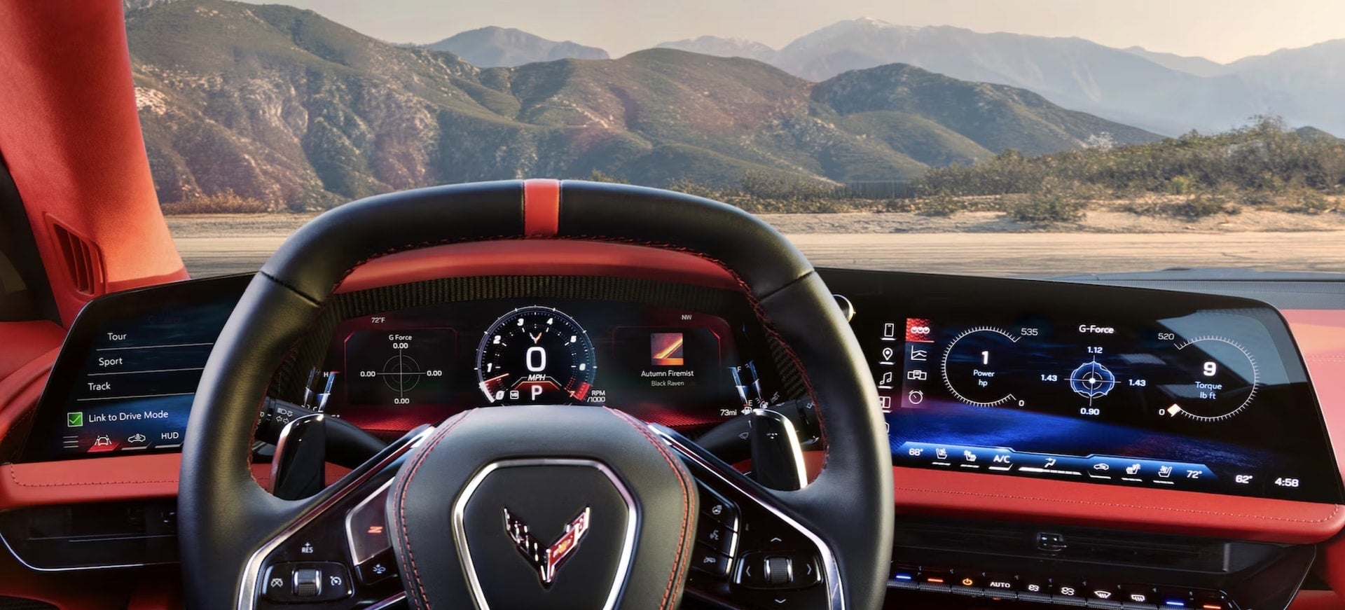 2027 Chevrolet Corvette Grand Sport driver view showing the digital dashboard, steering wheel and red leather interior