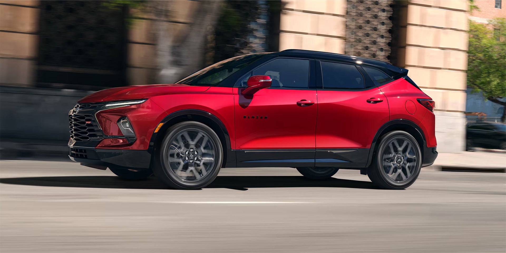 2026 Chevrolet Blazer driving on a road in the city