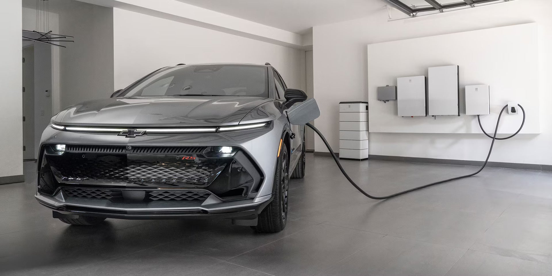 2026 Chevrolet Equinox EV plugged into an at home charger