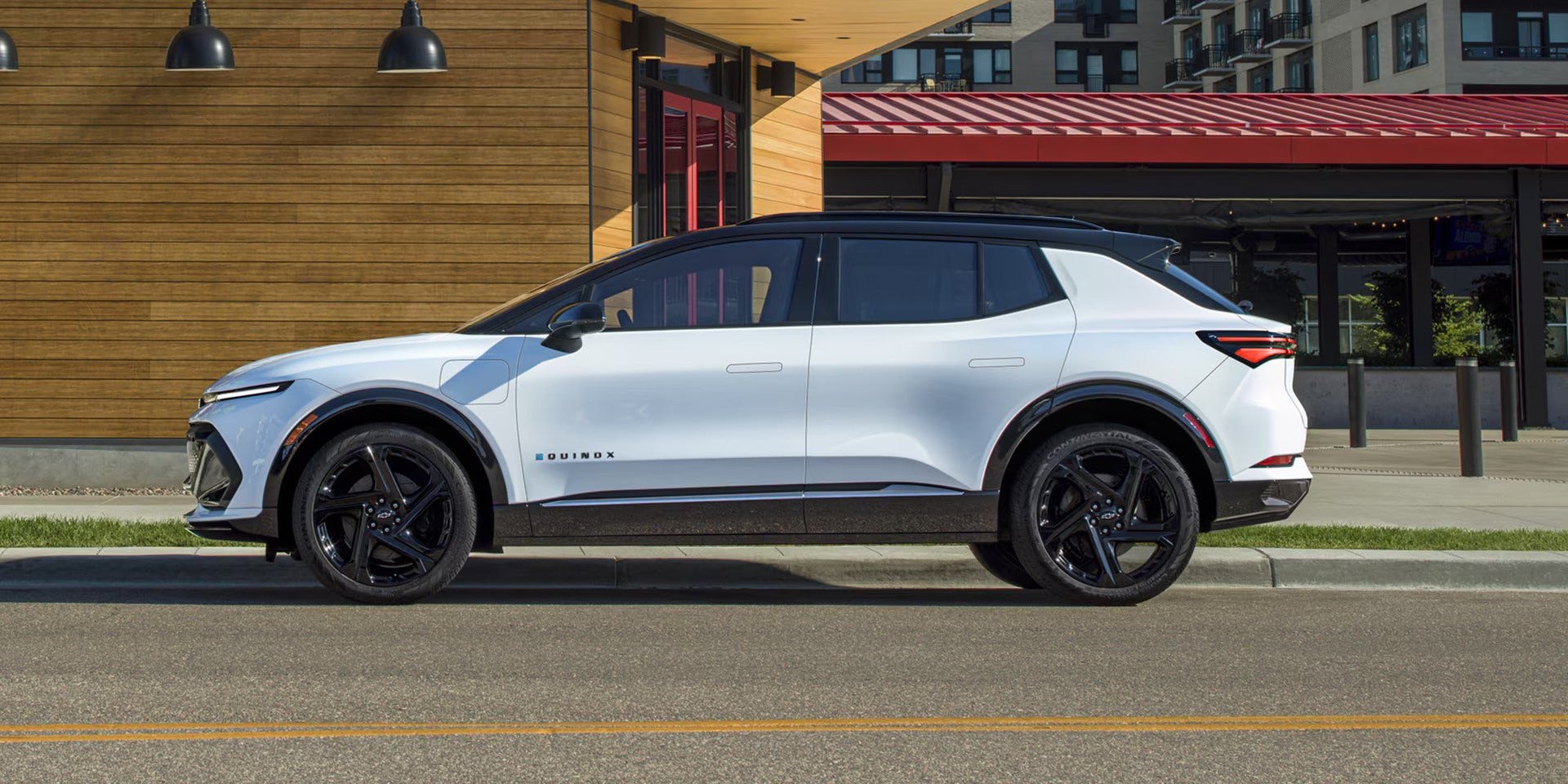 2026 Chevrolet Equinox EV parked outside of a building in the city