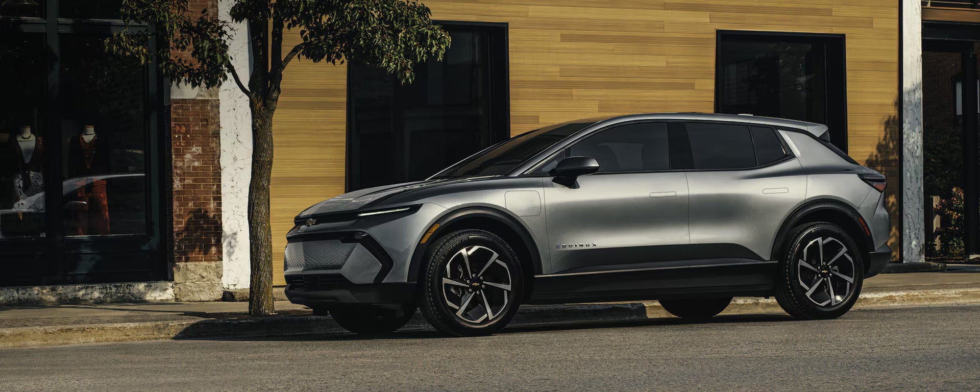 2026 Chevrolet Equinox EV parked on the street out in front of a building